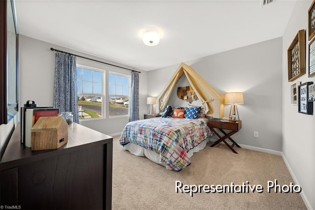 bedroom with carpet and baseboards