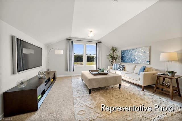 living area with lofted ceiling, light colored carpet, and baseboards