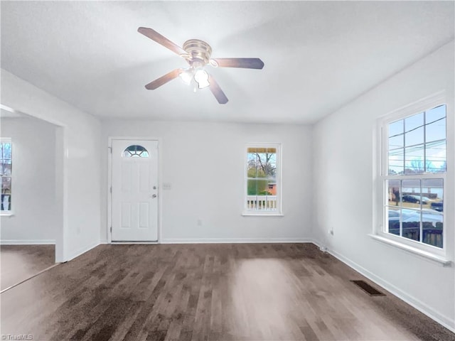 entrance foyer with ceiling fan, wood finished floors, visible vents, and baseboards