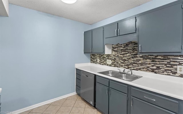 kitchen featuring dishwasher, sink, a textured ceiling, and decorative backsplash