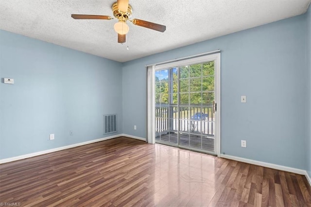 empty room featuring a textured ceiling, wood-type flooring, and ceiling fan