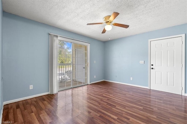 spare room featuring ceiling fan, a textured ceiling, and dark hardwood / wood-style floors