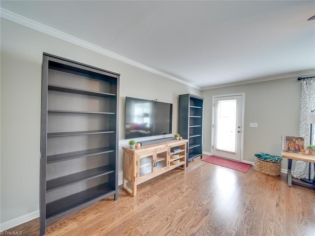 living room with hardwood / wood-style flooring and ornamental molding