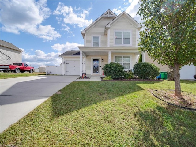 view of front of home with a front lawn and a garage