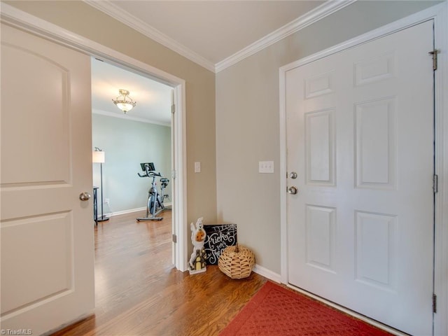 foyer entrance featuring hardwood / wood-style flooring and ornamental molding