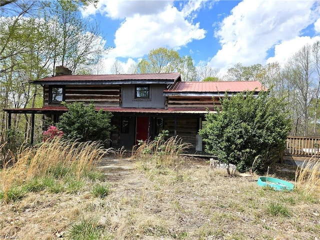 back of property with metal roof