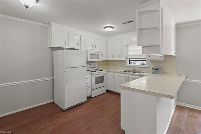 kitchen with white cabinetry, dark hardwood / wood-style flooring, white appliances, kitchen peninsula, and a textured ceiling