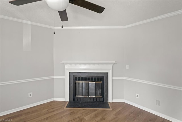 interior details featuring wood-type flooring, ceiling fan, and crown molding