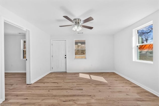 interior space with ceiling fan and light hardwood / wood-style floors