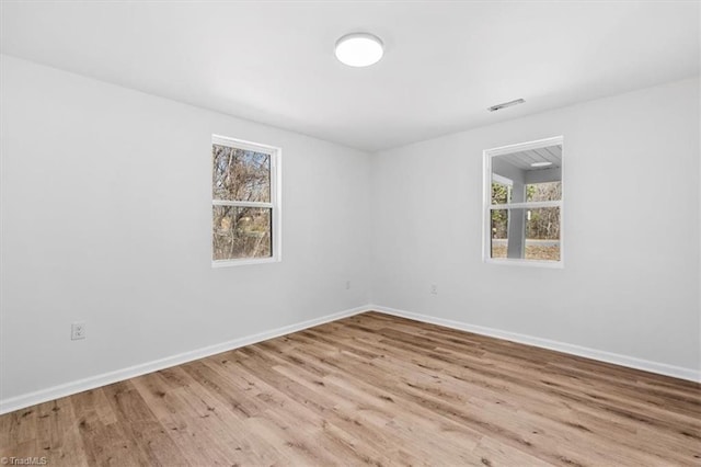 empty room with light wood-type flooring