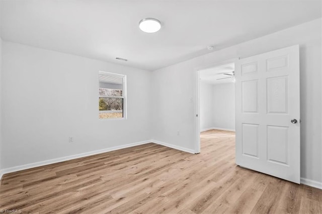 spare room featuring light hardwood / wood-style flooring