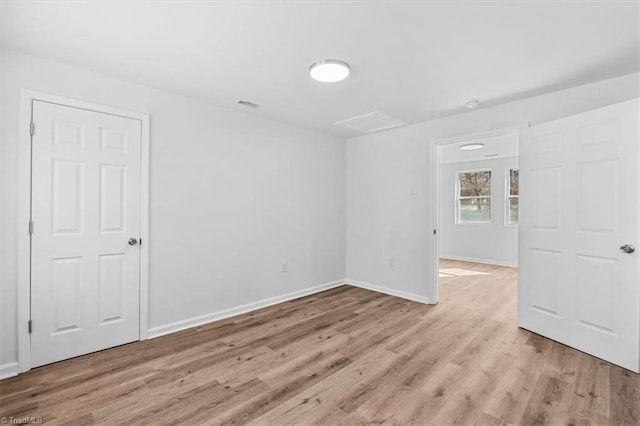 unfurnished room with light hardwood / wood-style floors