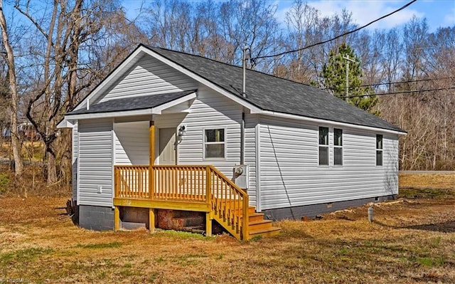 exterior space featuring a yard and a deck