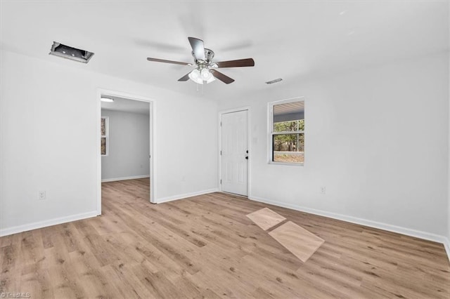 spare room with ceiling fan and light hardwood / wood-style floors