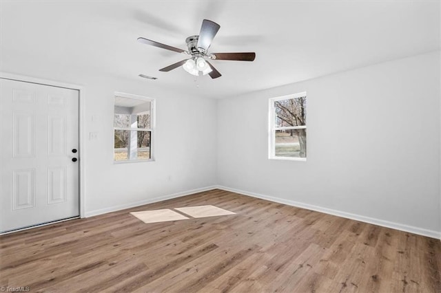 unfurnished room with ceiling fan and light hardwood / wood-style floors