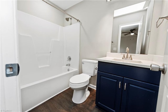 3217 N Ohenry Blvd, Greensboro, NC 27405 - bathroom with toilet, a ceiling fan, wood finished floors,  shower combination, and vanity