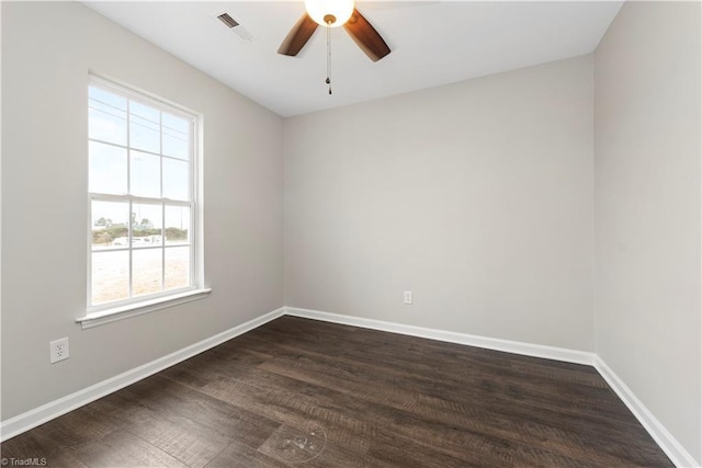 3217 N Ohenry Blvd, Greensboro, NC 27405 - spare room with visible vents, baseboards, dark wood-type flooring, and a ceiling fan