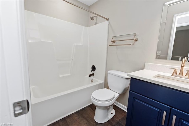 3217 N Ohenry Blvd, Greensboro, NC 27405 - bathroom with vanity, shower / tub combination, toilet, and wood finished floors
