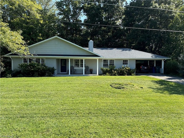 ranch-style house with driveway, a porch, a front lawn, and a carport