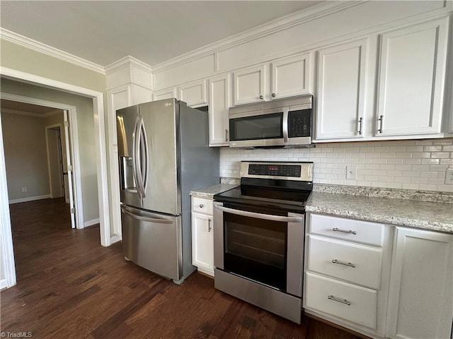 kitchen with appliances with stainless steel finishes, white cabinetry, and dark wood-style floors