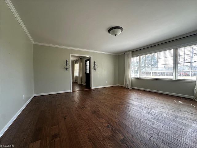 unfurnished living room with ornamental molding, dark wood-style flooring, and baseboards