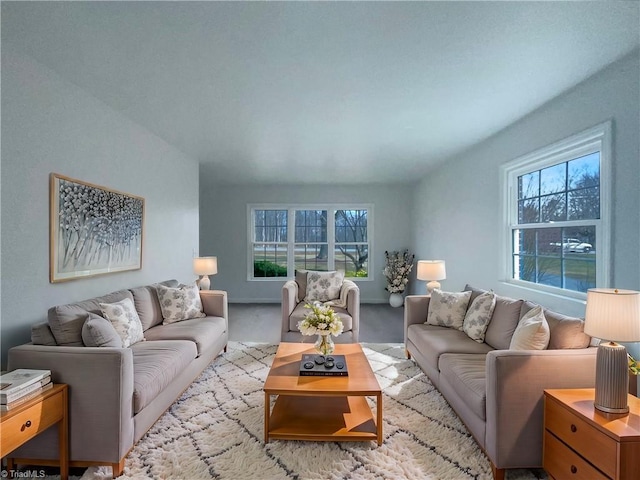 living room with light colored carpet and a wealth of natural light