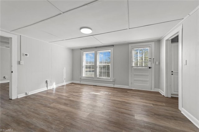 empty room with dark hardwood / wood-style floors