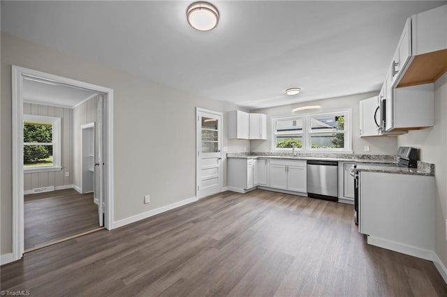 4108 Walker Ave, Greensboro, NC 27407 - kitchen featuring stainless steel dishwasher, dark wood-style floors, white cabinetry, and light stone countertops