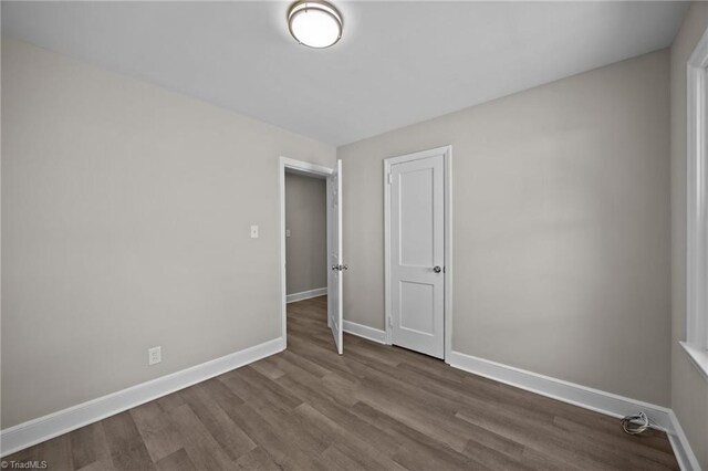 4108 Walker Ave, Greensboro, NC 27407 - empty room featuring baseboards and wood finished floors