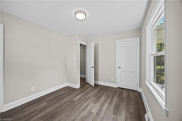 4108 Walker Ave, Greensboro, NC 27407 - unfurnished bedroom with wood finished floors and baseboards
