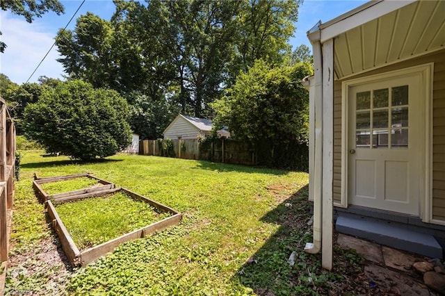4108 Walker Ave, Greensboro, NC 27407 - view of yard featuring a garden