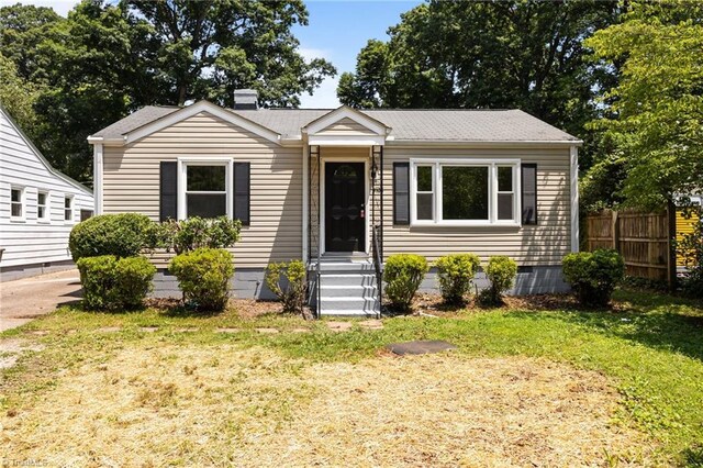 4108 Walker Ave, Greensboro, NC 27407 - view of front facade featuring a chimney