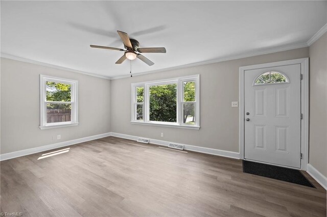 4108 Walker Ave, Greensboro, NC 27407 - entryway featuring healthy amount of natural light, ceiling fan, ornamental molding, and wood finished floors