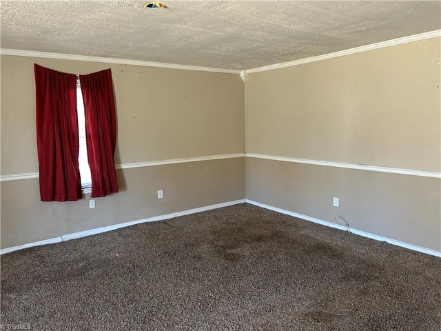 carpeted spare room featuring a textured ceiling, baseboards, and crown molding