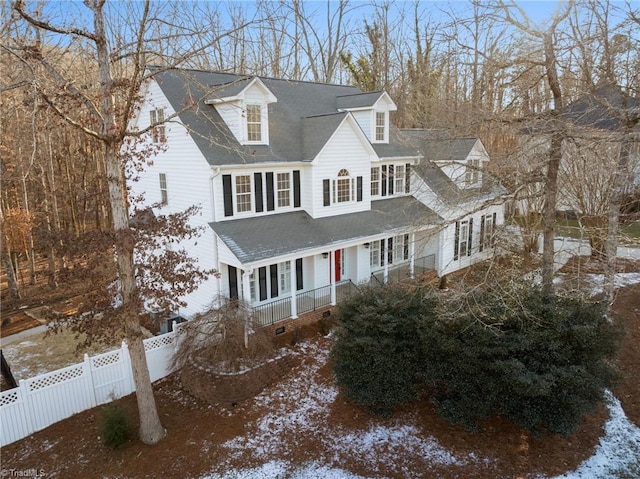 cape cod-style house with covered porch