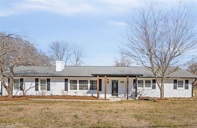 single story home with a front yard and covered porch