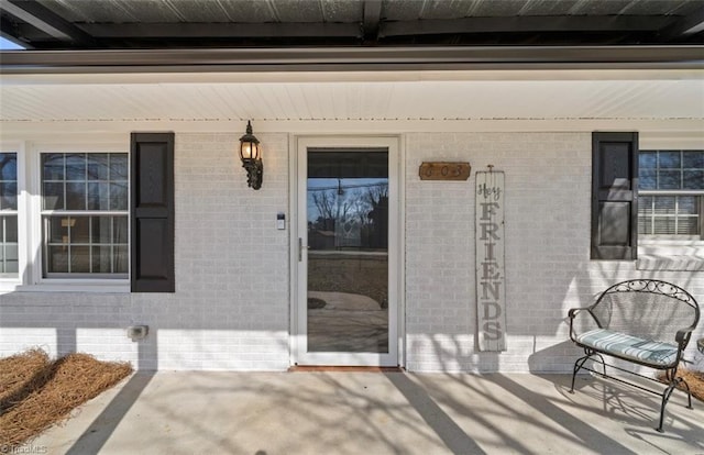 doorway to property with covered porch