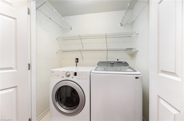 washroom featuring washing machine and dryer