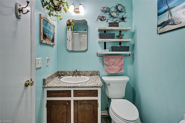 bathroom with vanity and toilet