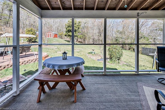 sunroom featuring wood ceiling