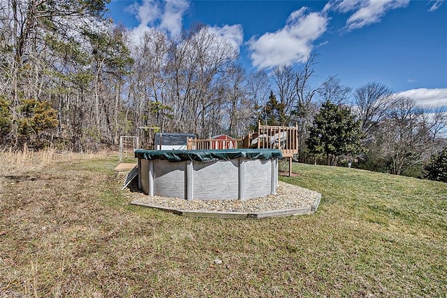 view of yard featuring a covered pool