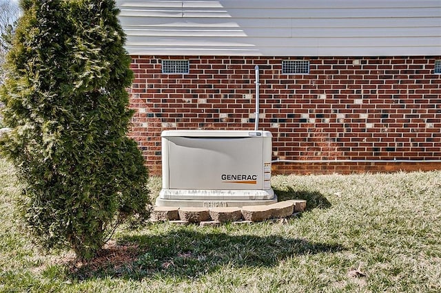 details featuring brick siding and a power unit