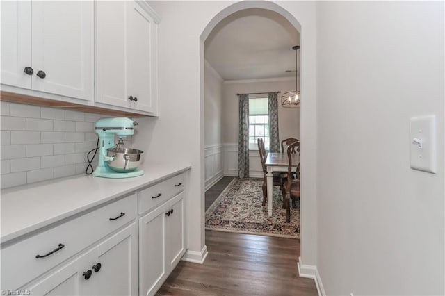 151 Outrigger Ln, Troutman, NC 28166 - hall with arched walkways, dark wood-type flooring, and ornamental molding