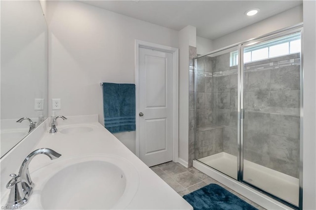 151 Outrigger Ln, Troutman, NC 28166 - bathroom featuring a stall shower, double vanity, and tile patterned flooring