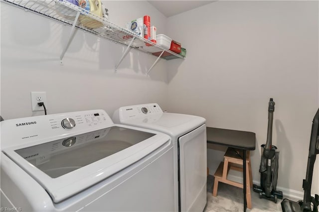 151 Outrigger Ln, Troutman, NC 28166 - laundry room featuring washing machine and clothes dryer and baseboards