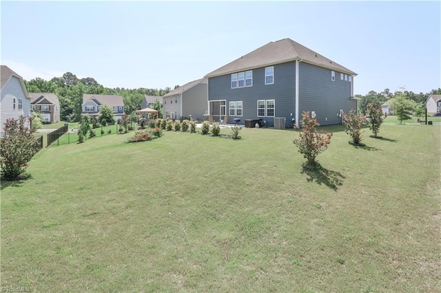 151 Outrigger Ln, Troutman, NC 28166 - view of green lawn with central AC and an attached garage