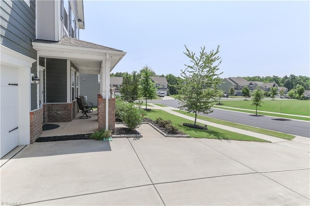 151 Outrigger Ln, Troutman, NC 28166 - porch featuring a yard and a residential view