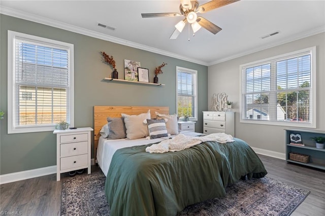 bedroom featuring ornamental molding, dark wood finished floors, and visible vents