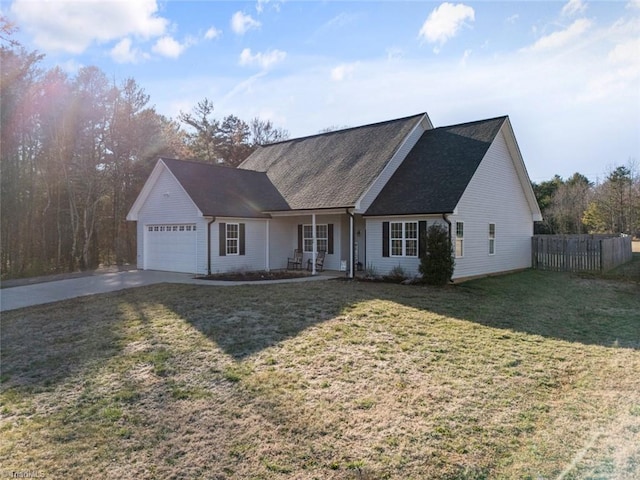 ranch-style home featuring a garage, a front yard, concrete driveway, and fence