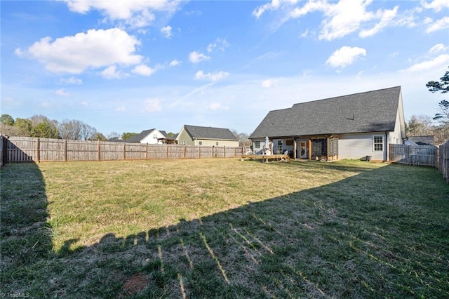 view of yard with a fenced backyard